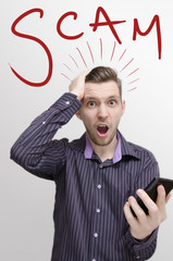 Smart phone scams concept,shocked guy with open mouth