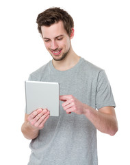 Man using a tablet computer against a white background