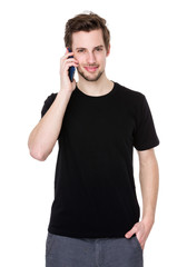 Portrait of happy young man talking on cell phone isolated on wh