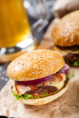 Delicious burger on wooden board