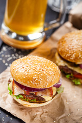 Delicious burger on wooden board