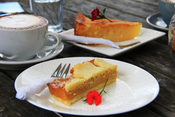 Cup of cappuccino and a slice of cake