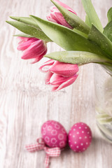 Tulips and Easter eggs on the table