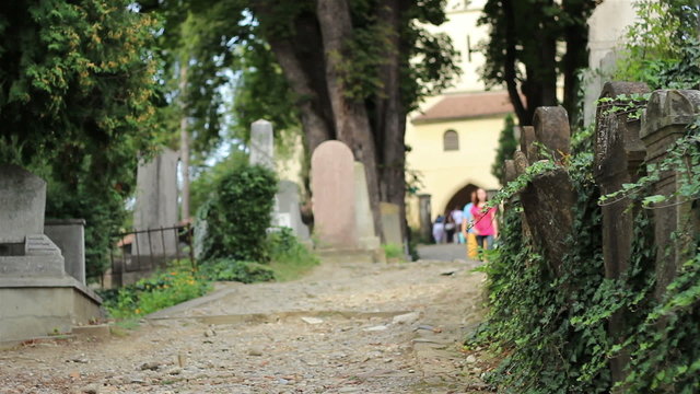 People Walking in Old Cemetery