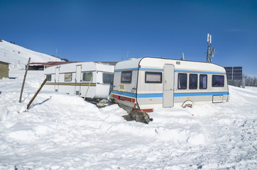 car caravan trailer - winter snow ice forest firs