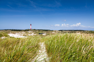 Fototapeta na wymiar Dune landscape with lighthouse at North Sea, Germany