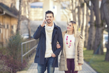 Young couple walking in the town