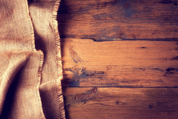 Burlap texture on wooden table background