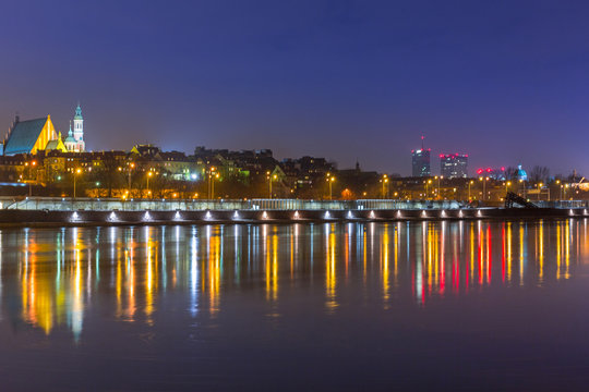 Fototapeta Panorama of Warsaw at night with reflection in Vistula river