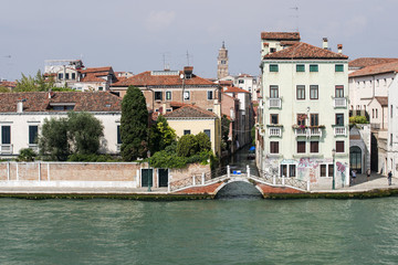 Quay and bridge over small channel in Venice