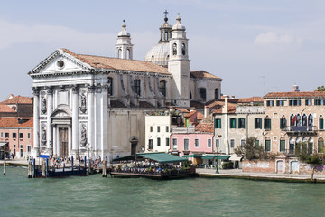Fototapeta na wymiar View to Gesuati Quay and Santa Maria del Rosario cathedral in su