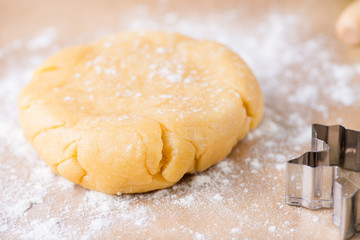 Shortcrust pastry dough, unrolled and unbaked on a floured surfa
