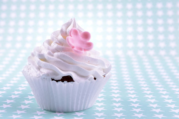 Delicious cupcake on light background