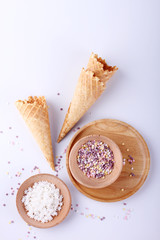 empty ice cream cones with colorful sprinkles