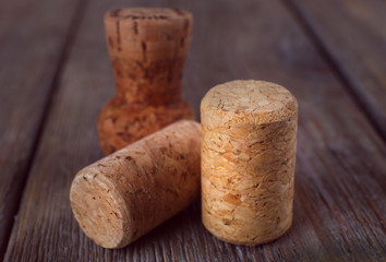 Wine corks on rustic wooden planks background
