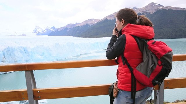 Tourist taking picture of Perito Moreno Glacier