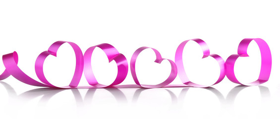 Purple hearts from ribbon isolated on white