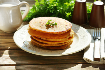 Stack of corn tortillas with stuffing and greens