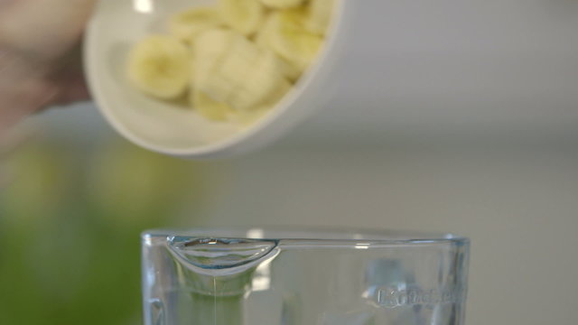 Close shot of woman making smoothy
