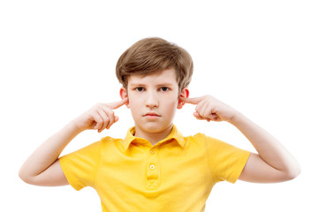 a teenage boy plugs ears - 79666076