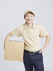 studio portrait of a smiling delivery man