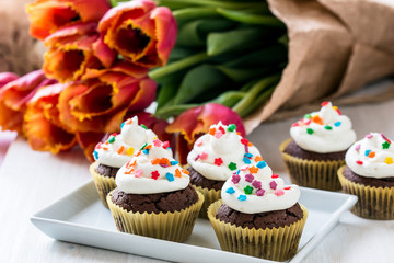 Mothers day  chocolate cupcakes  with spring tulips