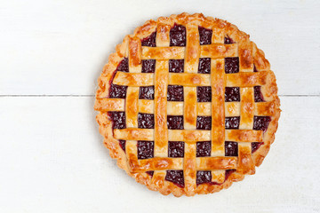 Raspberry pie with fresh raspberries on white background