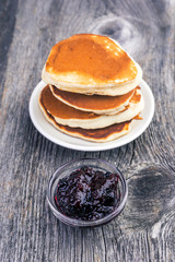 stack of pancake with currant jam.  Soft focus.