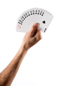 Hand Holding Fanned Cards Showing Club Suit