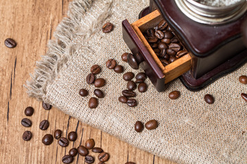 Fototapeta na wymiar Antique coffee grinder and coffee beans