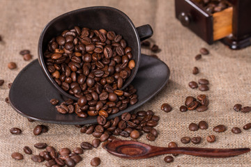 coffee beans in a coffee cup on sackcloth