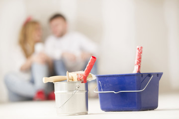 .Happy young couple doing a odd-job in their new houseHappy youn