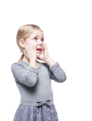 Beautiful little girl surprised looking up on something isolated © darkbird