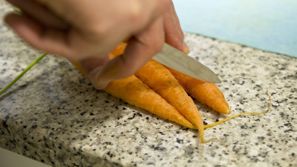 Fototapeta na wymiar Cutting carrots