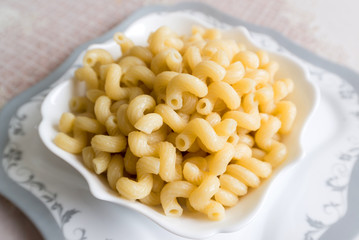 Boiled the pasta in a bowl on  table