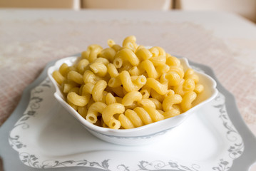 Boiled the pasta in a bowl on  table
