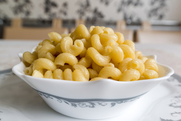 Boiled the pasta in a bowl on  table