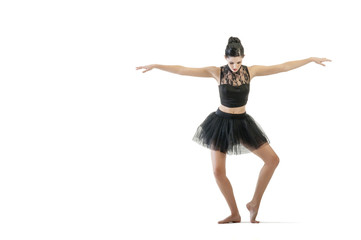 Young attractive ballerina doing alternate dance moves