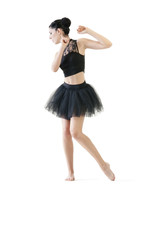 Young attractive ballerina doing alternate dance moves