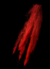 Freeze motion of red dust explosion isolated on black