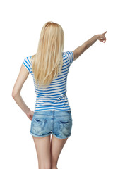 Back view Full length of young slim tanned female in denim short