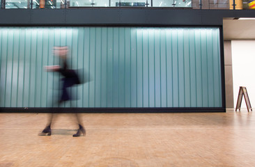 London Train Tube station Blur people movement in rush hour, at