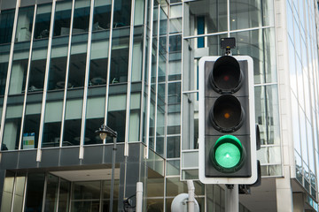 Green, Yellow and Red Traffic Light in the London city..