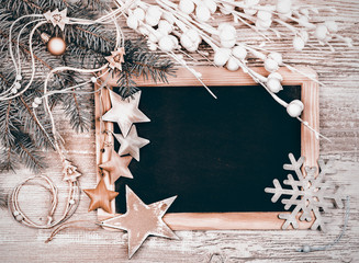 Black chalkboard with winter decorations, text space