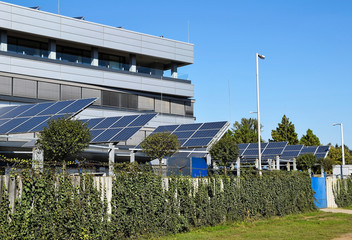 Solar panels next to a new office building