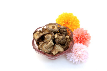 dry mushrooms in purple glass bowl
