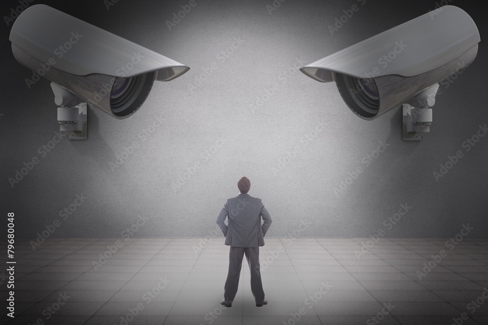 Poster composite image of businessman standing with hands on hips