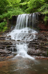 Cascading waterfall in the forest in the Ternopil region. Ukraine.