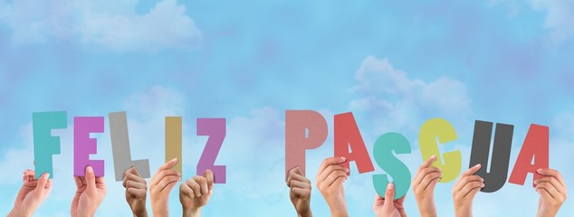 Composite image of hands holding up feliz pasqua