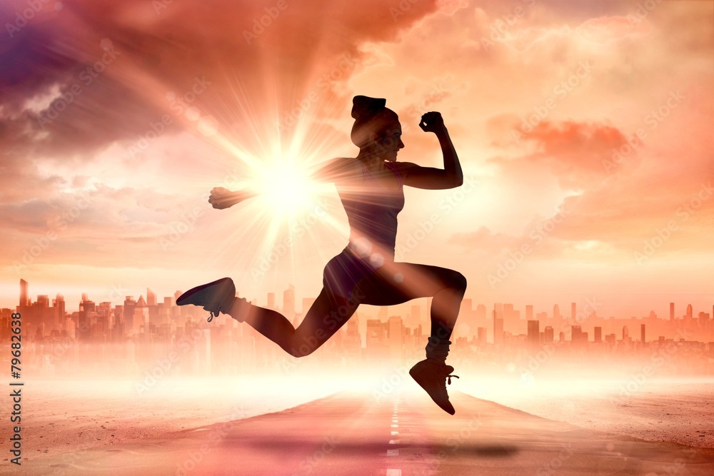 Poster Composite image of fit brunette running and jumping